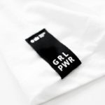 GRL PWR collection tag on T-shirt